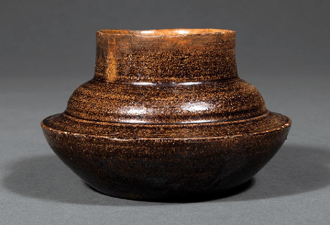 George Ohr Art Pottery Vase: George Ohr Art Pottery Vase, c. 1883-1898, squat baluster form, brown mottled glaze, base impressed "G.E.O. E. OHR/Biloxi, Miss", h. 2 3/4 in., dia. 4 1/4 in