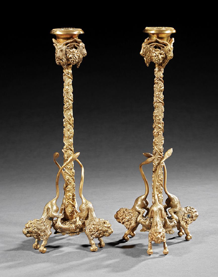 Pair of Regency-Style Gilt Bronze Candlesticks: Pair of Regency-Style Gilt Bronze Candlesticks, ram's head mounts, twisted grapevine standards, lion supports, h. 12 3/4 in., dia. 5 1/2 in
