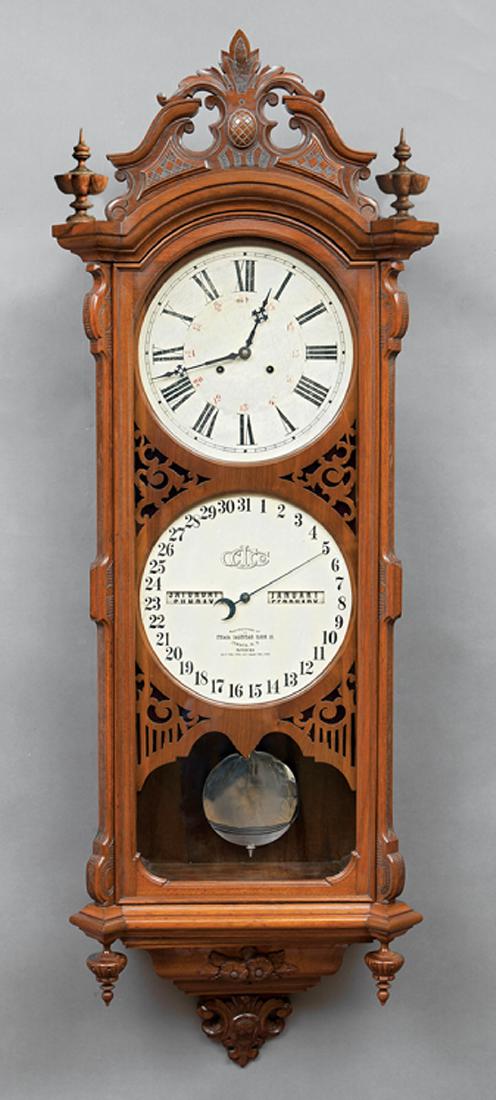 Ithaca Walnut No. 0 Bank Calendar Regulator Clock: Ithaca Walnut No. 0 Bank Calendar Regulator Clock, c. 1880, 12-inch, dial marked "Manufactured by Ithaca Calendar Clock Co., Ithaca, NY, Patented April 18th, 1865, and August 28th, 1866", two weights,