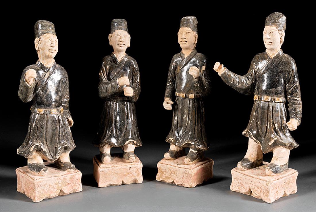 Group of Four Chinese Glazed Pottery Attendants: Group of Four Chinese Glazed Pottery Attendants, probably Ming Dynasty (1368-1644), h. 13 7/8 in. to 14 1/2 in