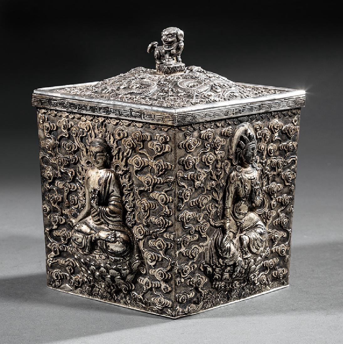 Chinese Export Luen Wo Silver or Silverplate Box: Chinese Export Luen Wo Silver or Silverplate Covered Box, probably late 19th/early 20th c., square sides relief-decorated with Bodhisattvas on cloud grounds, cover with a Buddhist lion finial, base wi
