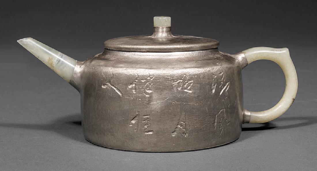 Chinese Hardstone-Mounted Zisha Pottery Teapot: Chinese Hardstone-Mounted Silver Painted Zisha Pottery Teapot, probably 20th c., incised with calligraphy and floral sprays, base marked, h. 2 3/4 in., w. 7 in.