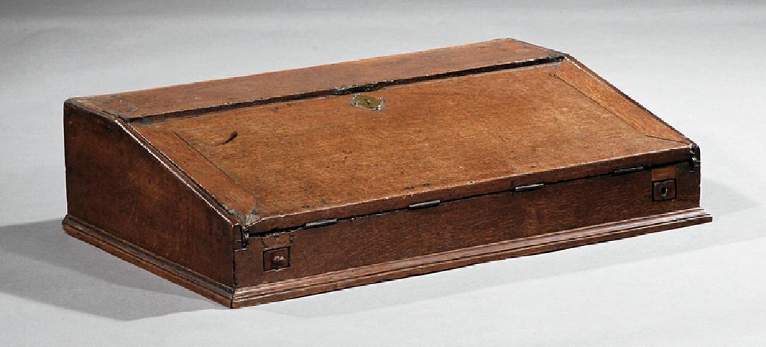 Early Georgian Oak Writing Box: Early Georgian Oak Writing Box, 18th c., slant-front lid, fitted interior with small drawers, molded base, h. 7 1/2 in., w. 29 in., d. 18 1/2 in