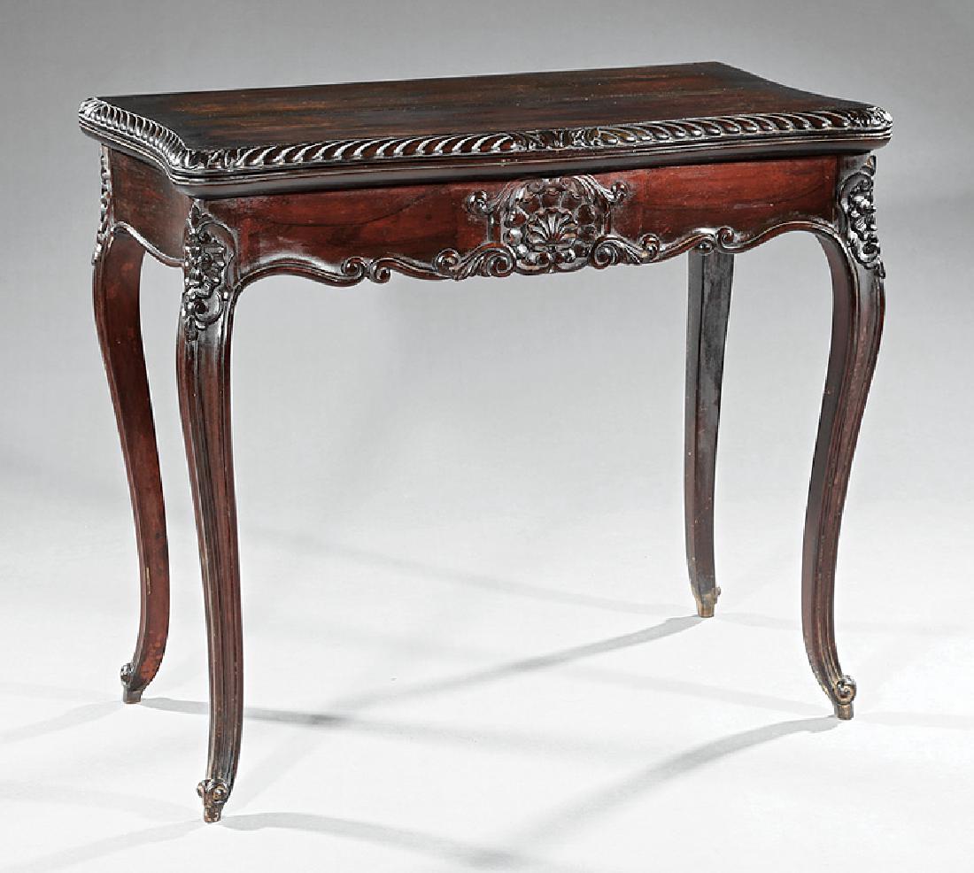 American Rococo Carved Mahogany Games Table: American Rococo Carved Mahogany Games Table, mid-19th c., serpentine foldover top with gadrooned edge, baize-lined playing surface, conforming scrolled frieze, cabriole legs, scrolled toes, h. 29 1/2 