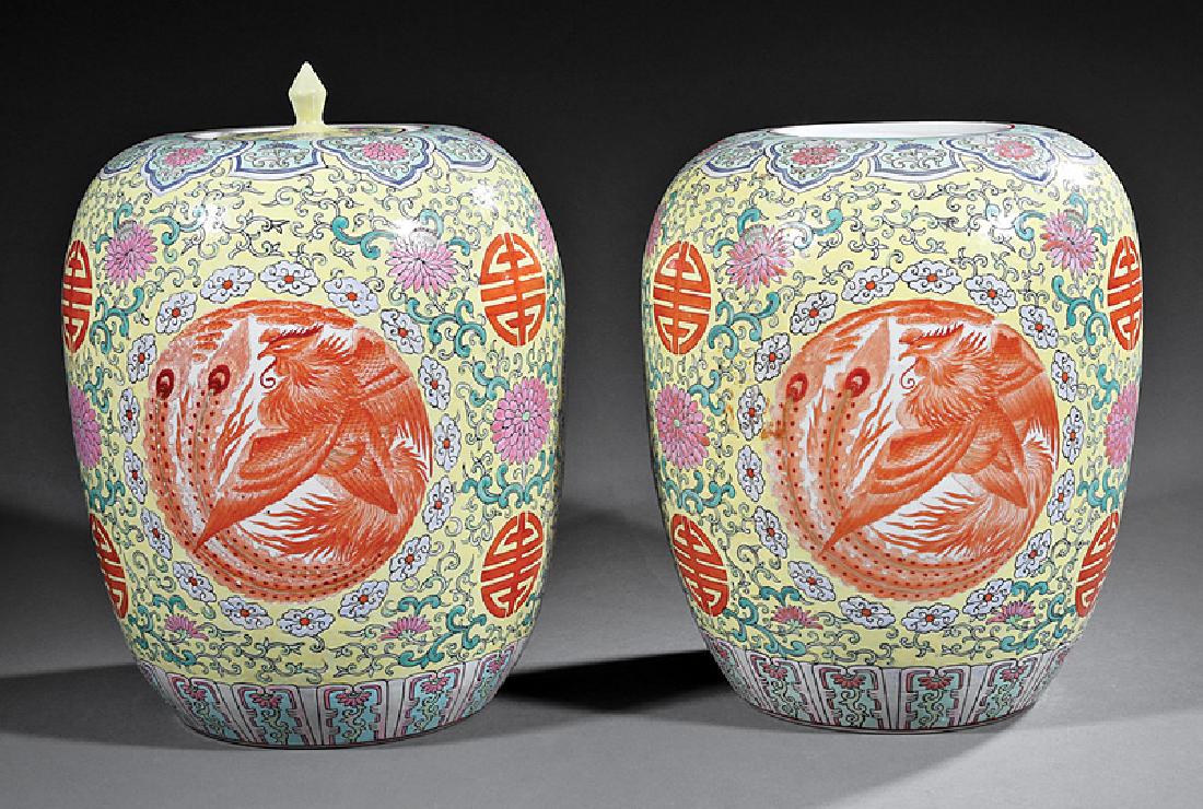 Chinese Famille Jaune Porcelain Covered Jars: Two Decorative Pairs of Chinese Famille Jaune Porcelain Covered Jars, probably mid-20th c., larger decorated with iron red phoenix roundels, one lacking cover, h. 13 in. and 11 1/4 in., smaller with l