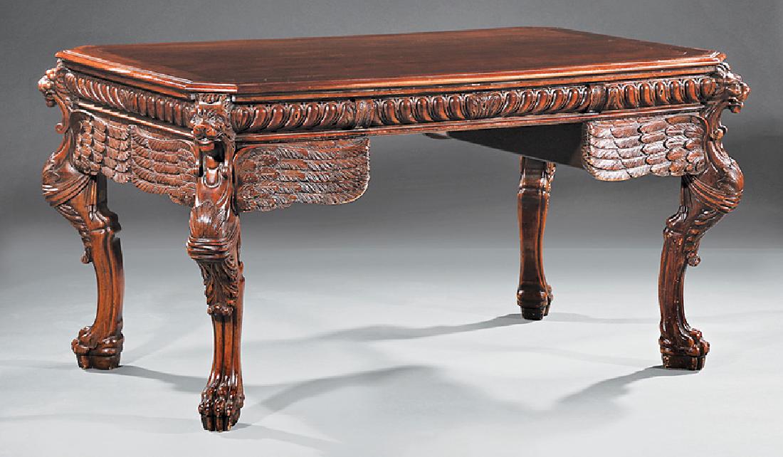 French Carved and Figured Walnut Bureau Plat: Good French Carved and Figured Walnut Bureau Plat, early 20th c., molded top with canted corners, gadrooned frieze, kneehole configuration of drawers, winged griffin legs, paw feet, labeled "Meubles d