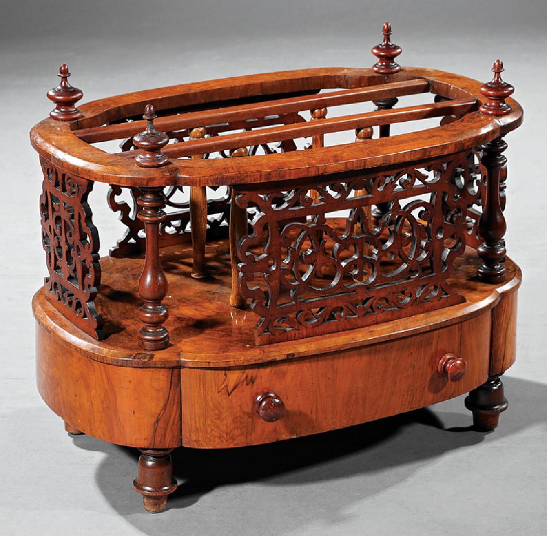 English Burl Walnut Oval Canterbury: English Burl Walnut Oval Canterbury, mid-19th c., with turned uprights and reticulated scrollwork panels, base drawer, turned feet, h. 20 in., w. 25 in., d. 17 in