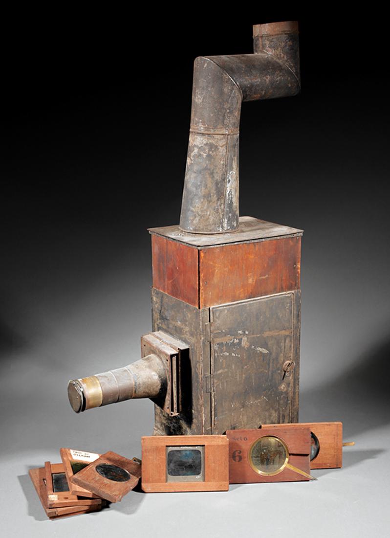 Large Collection of Magic Lantern Slides: Large Collection of Magic Lantern Slides, the wood framed examples incl. 12 crank operated, 2 lever, 41 slip slides, 46 still; together with over 100 strip slides, with a tin magic lantern and Chadwic