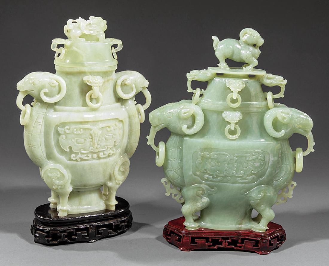 Two Chinese Carved Serpentine Covered Vases: Two Chinese Carved Serpentine Covered Vases, 20th c., each with twin ram bodies and ram's head loose ring handles, lighter with Buddhist lion finial, darker with ram finial, h. 12 1/2 in. and 12 5/8 i