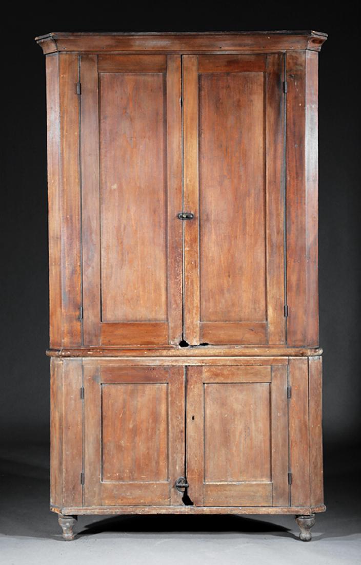 American Late Federal Poplar Corner Cupboard: American Late Federal Poplar Corner Cupboard, early 19th c., cove-molded cornice, paneled doors, conforming base, turned feet, h. 91 in., w. 50 1/2 in., d. 31 1/4 in