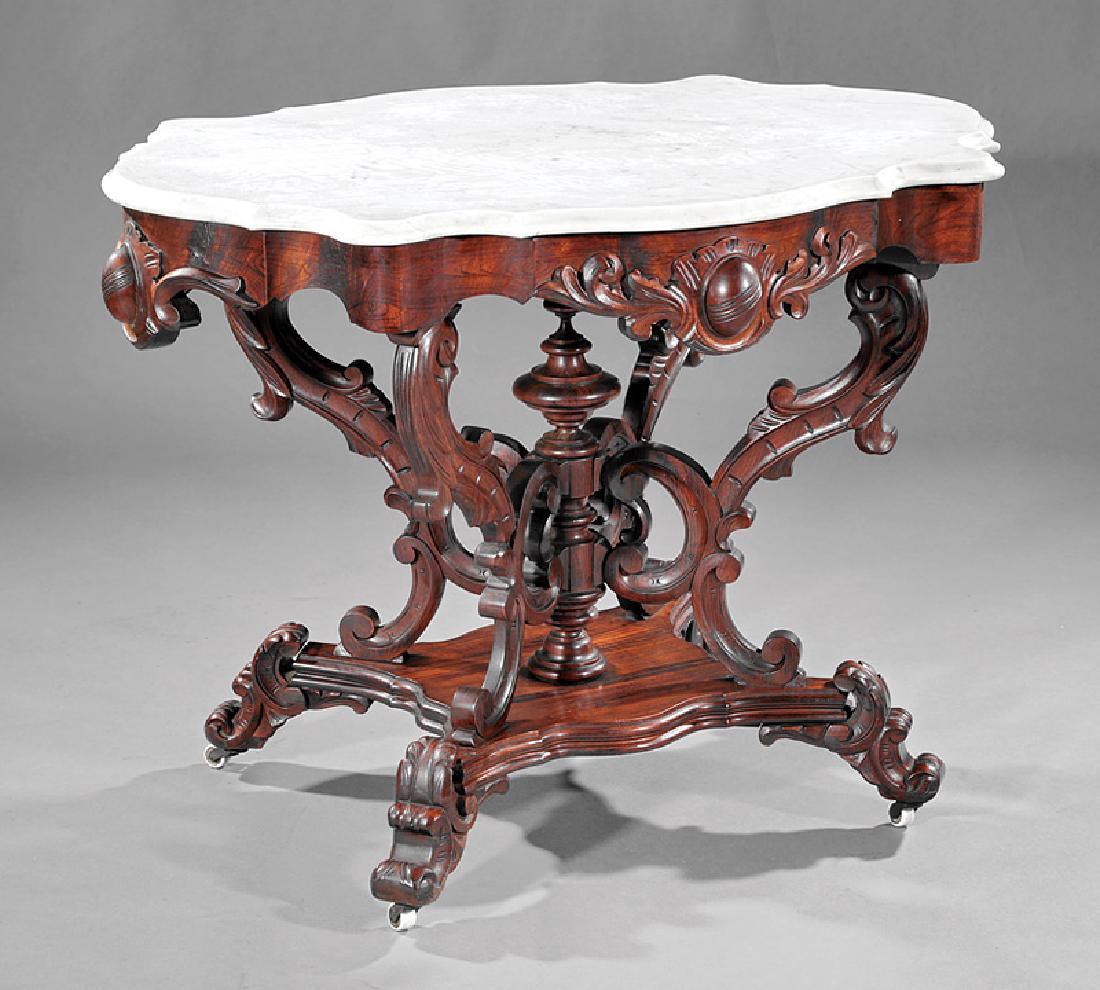 American Rococo Carved Rosewood Center Table: American Rococo Carved Rosewood Center Table, c. 1850-1860, molded marble top, cartouche carved frieze, C and S carved scroll supports, serpentine plinth, acanthus scrolled feet, h. 30 in., w. 39 1/2 