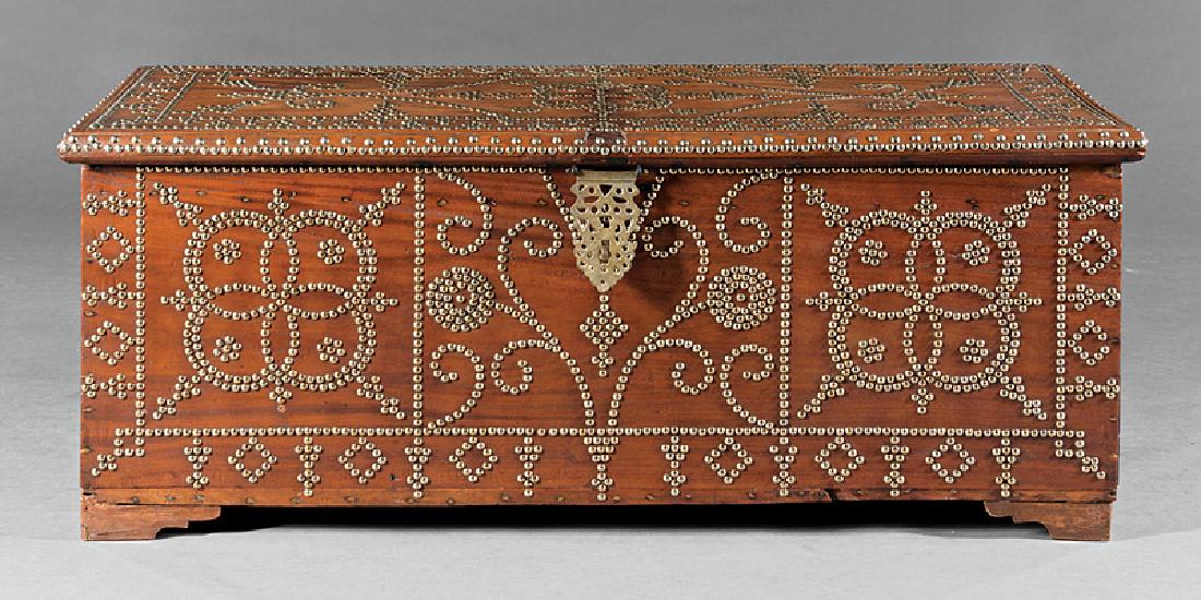 Antique Spanish Colonial-Style Hardwood Chest: Antique Spanish Colonial-Style Hardwood Chest, early 19th c., lift top, strap hinges, carrying handles, bracket feet, overall elaborate brass nailhead decoration, h. 19 in., w. 46 in., d. 18 in