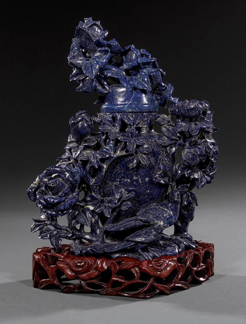 Chinese Carved Sodalite Covered Vase: Chinese Carved Sodalite Covered Vase, 20th c., with birds and roses, h. 8 3/4 in., w. 7 in., stand, overall h. 9 3/4 in. Provenance: Estates of Maurice and Eunice Lion, Metairie, LA