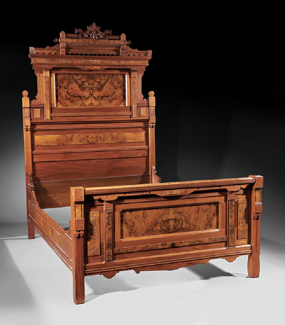 American Aesthetic Carved, Burl Walnut Bedstead: American Aesthetic Carved and Burl Walnut Bedstead, c. 1880, molded pediment with stylized incised foliage, paneled headboard, conforming foot board and rails, shaped skirt, block feet, h. 91 1/2 in.,