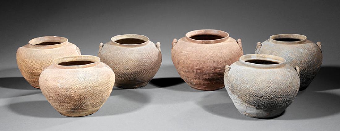 Collection of Six Chinese Pottery Vessels: Collection of Six Chinese Pottery Vessels, possibly Warring States Period (475 BCE - 221 BCE), globular bodies with impressed star surfaces, h. 5 1/2 in. to 6 in., dia. 7 in. to 8 in
