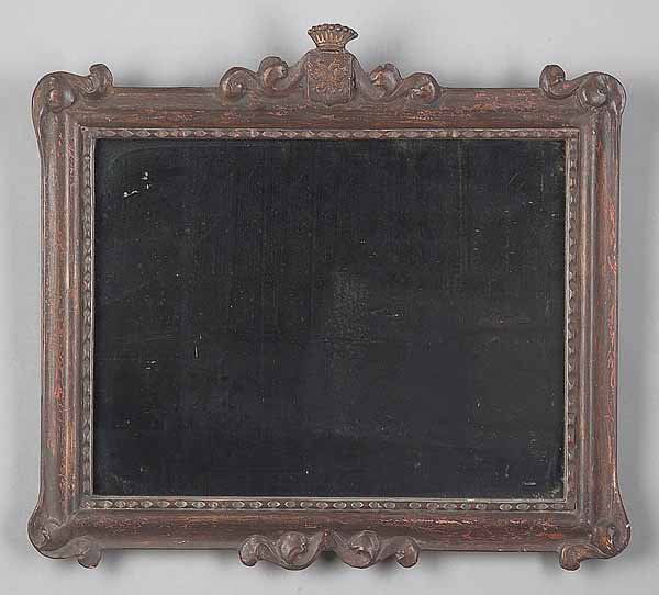 Small Antique Russian Carved Mirror: A Small Antique Russian Carved Mirror , mid-19th c., the crest with impaired crown above double headed eagle shield, the molded frame with scrolls and volutes with beaded inner border, traces of red p