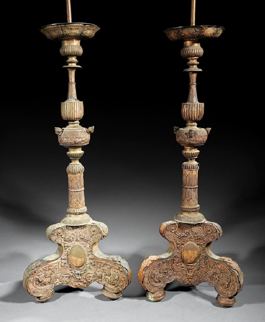 Spanish Colonial Silver Altar Candlesticks: Spanish Colonial Silver Altar Candlesticks, 18th c., standard with foliate and fluted design, cherub busts, tripartite base, now mounted as lamps,h. 29 1/2 in., dia. 11 1/2 in., h. to socket 40 in. Pr
