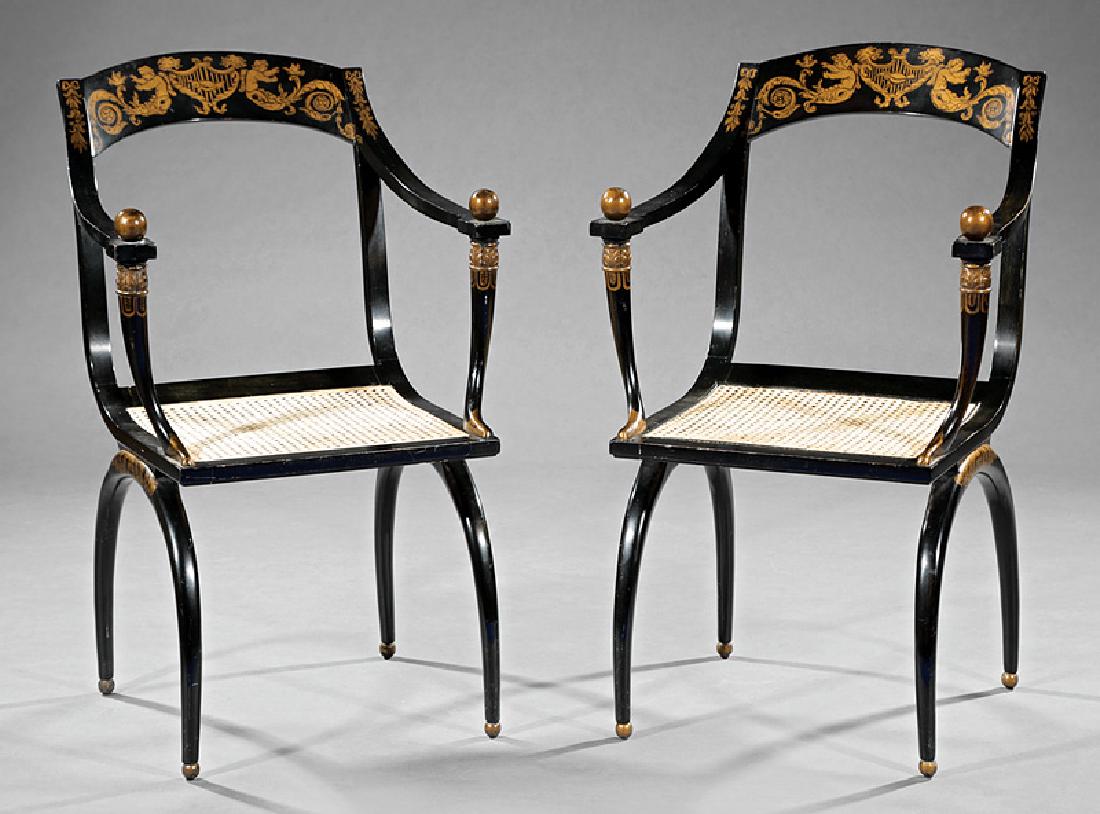 Directorie-Style Gilded and Ebonized Armchairs: Pair of Directorie-Style Gilded and Ebonized Armchairs, after Jean-Joseph Chapuis, incurvate crest rail with putti and acanthus scrolls, arms with by ball finials, foliate carved round tapered upright