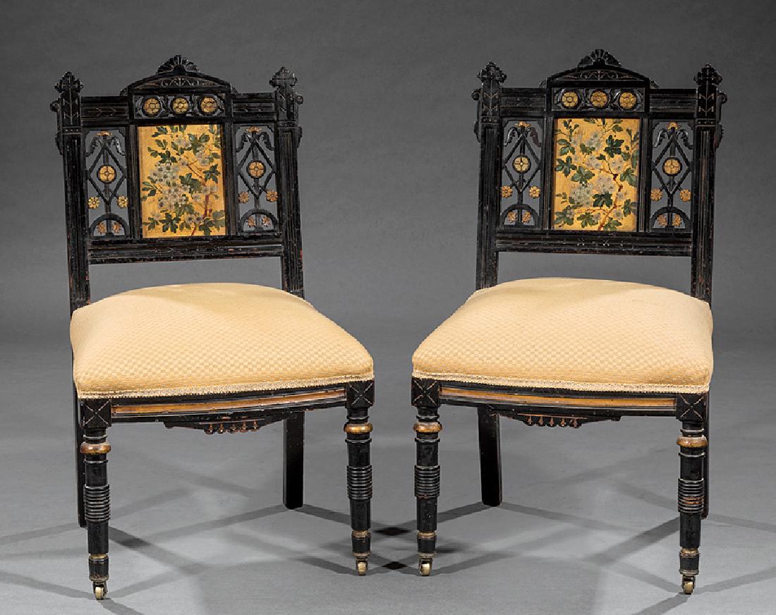 Ebonized, Incised, and Gilt Slipper Chairs: Pair of American Aesthetic Ebonized, Incised, and Gilt Slipper Chairs, late 19th c., polychromed back splat, turned legs, casters, h. 32 in., w. 19 in., d. 16 1/2 in. Provenance: Collection of Henri S