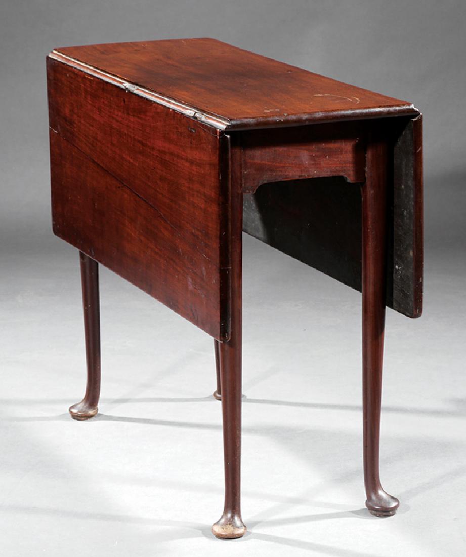 Georgian Mahogany Drop-Leaf Table: Georgian Mahogany Drop-Leaf Table, late 18th c., bracketed frieze, tapered legs, pad feet, h. 27 in., l. (open) 38 1/2 in., l. (closed) 13 1/2 in., w. 33 1/2 in