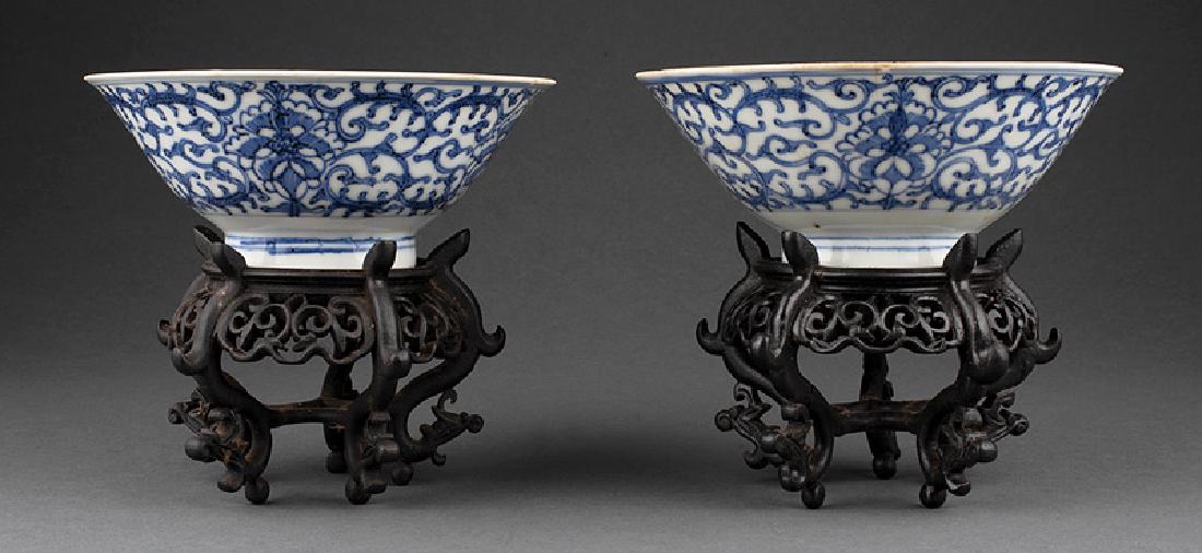 Pair of Chinese Blue and White Porcelain Bowls: Pair of Chinese Blue and White Porcelain Bowls, probably Ming Dynasty (1368-1644), decorated with foliate scrolls, heaping and piling glaze, bases with fu marks, h. 2 3/4 in., dia. 7 in., stands, over