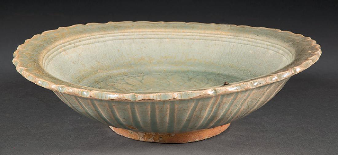 Chinese Celadon Stoneware Foliate Rim Dish: Chinese Celadon Stoneware Foliate Rim Dish, Ming Dynasty (1368-1644), lobed exterior, interior well carved with leaf sprays, h. 2 5/8 in., dia. 9 3/4 in. Provenance: The Sturm Collection