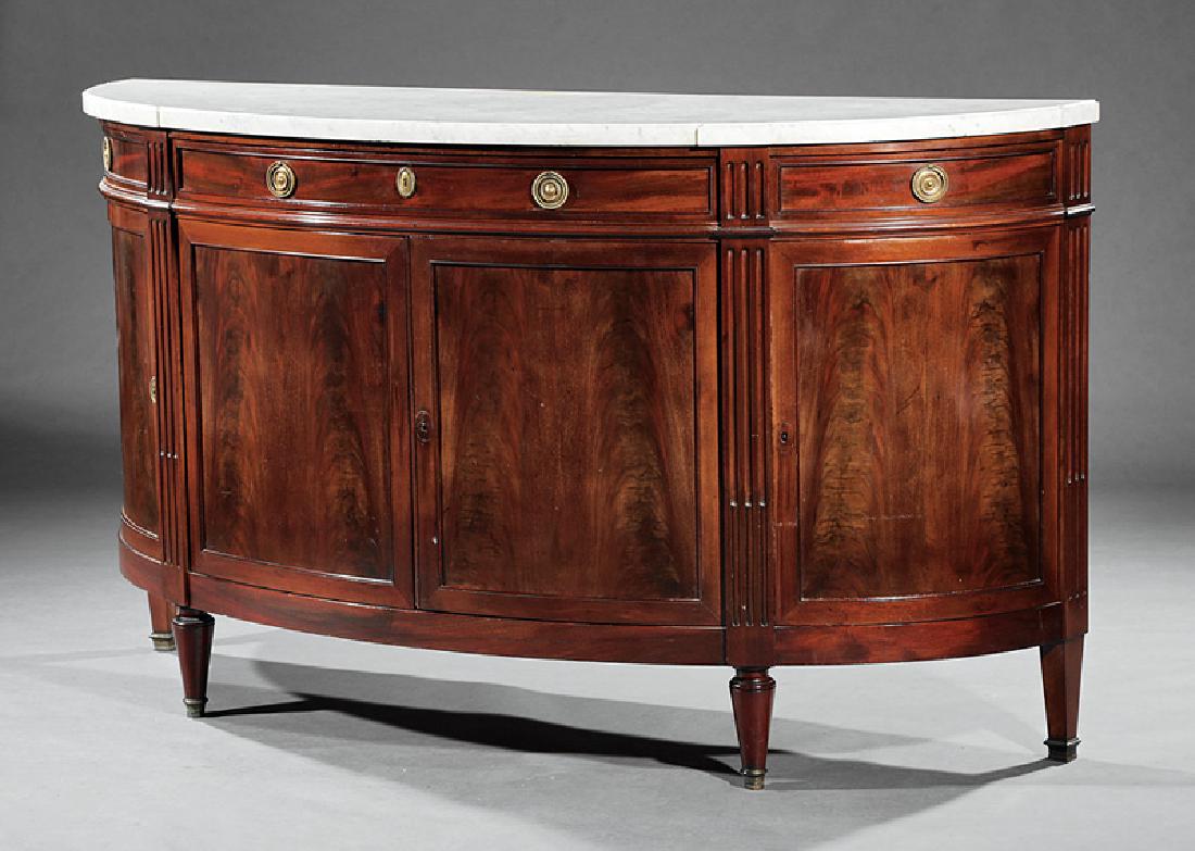 Louis XVI-Style Mahogany Demilune Sideboard: Louis XVI-Style Mahogany Demilune Sideboard, 20th c., marble top, frieze with center drawer flanked by two swing drawers, over paneled doors, shelf interior, fluted stiles, turned and tapered legs, h.