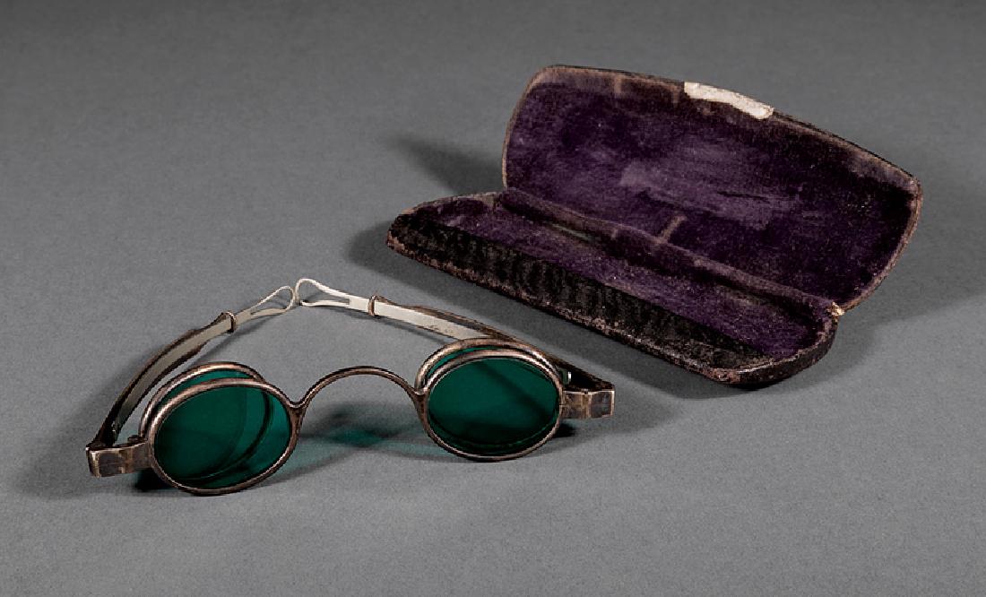 J.S. Curtis Coin Silver Spectacles: Tennessee Coin Silver Spectacles, mid-19th c., J.S. Curtis, Memphis, marked "J.S. CURTIS" in rectangle, 4 green oval lenses, extension temple arms; together with accompanying case. (2 pcs.)
