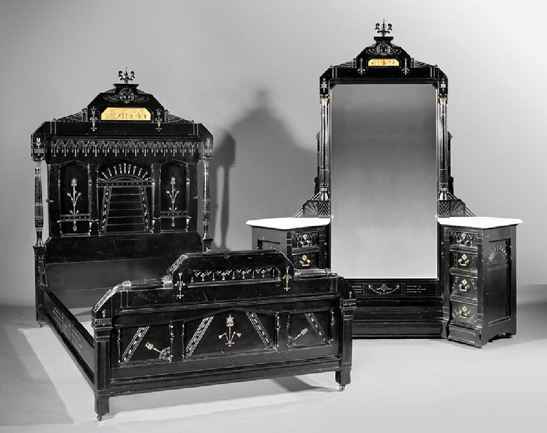 Two-Piece Bedroom Suite, stamped Herter Brothers: American Aesthetic Ebonized and Gilt Decorated Two-Piece Bedroom Suite in the Egyptian Taste, c. 1870-1880, stamped Herter Brothers, New York, incl. bed and dressing chest, bed with winged crest cente