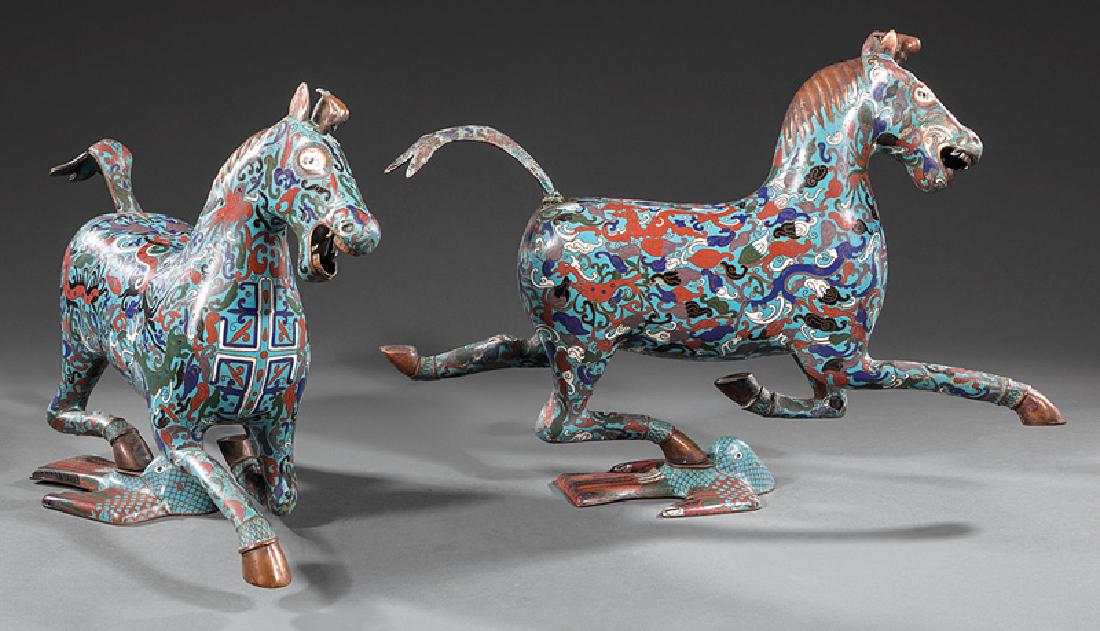 Pair of Chinese Cloisonne Enamel Horses: Pair of Chinese Cloisonne Enamel Horses, modeled in galloping pose with one hoof resting on a stylized phoenix, h. 11 in. and 12 1/4 in., w. 18 1/4 in. and 18 3/4 in. Provenance: Estates of Maurice an