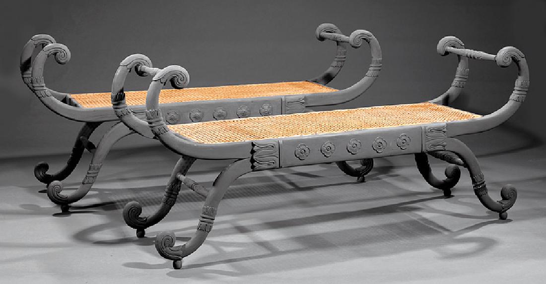 Carved and Painted Window Benches: Pair of Regency-Style Carved and Painted Window Benches, scrolled arms, caned seat, seat rail with rosettes, scrolled legs, h. 25 1/2 in., w. 56 in., d. 15 3/4 in
