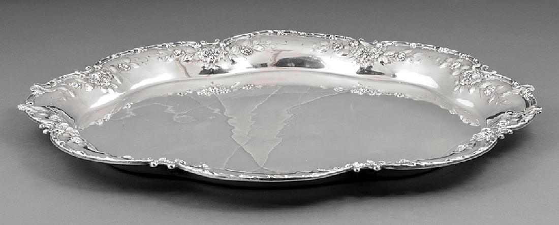 George W. Shiebler & Co. Sterling Silver Tray: American Sterling Silver Tray, George W. Shiebler & Co., New York, act. 1876-1910, ret. Frank Herschede, Cincinnati, shaped oval with floral and scroll border, 18 1/4 in. x 15 1/8 in., wt. 48.75 troy 