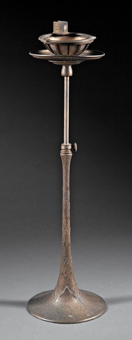 Tiffany Studios Bronze Adjustable Ashtray Stand: Tiffany Studios Bronze Adjustable Ashtray Stand, early 20th c., base plate stamped "Tiffany Studios / New York / 1651", hinged rim with match holder, "artichoke" standard, h. 27 to 37 in. Provenance: 