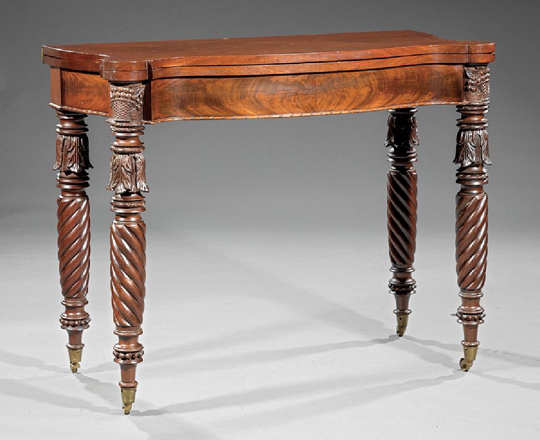 American Federal Carved Mahogany Games Table: American Federal Carved Mahogany Games Table, early 19th c., in the style of Samuel McIntyre, serpentine foldover top with outset corners, rope molded frieze, basket of flowers above front acanthus ca