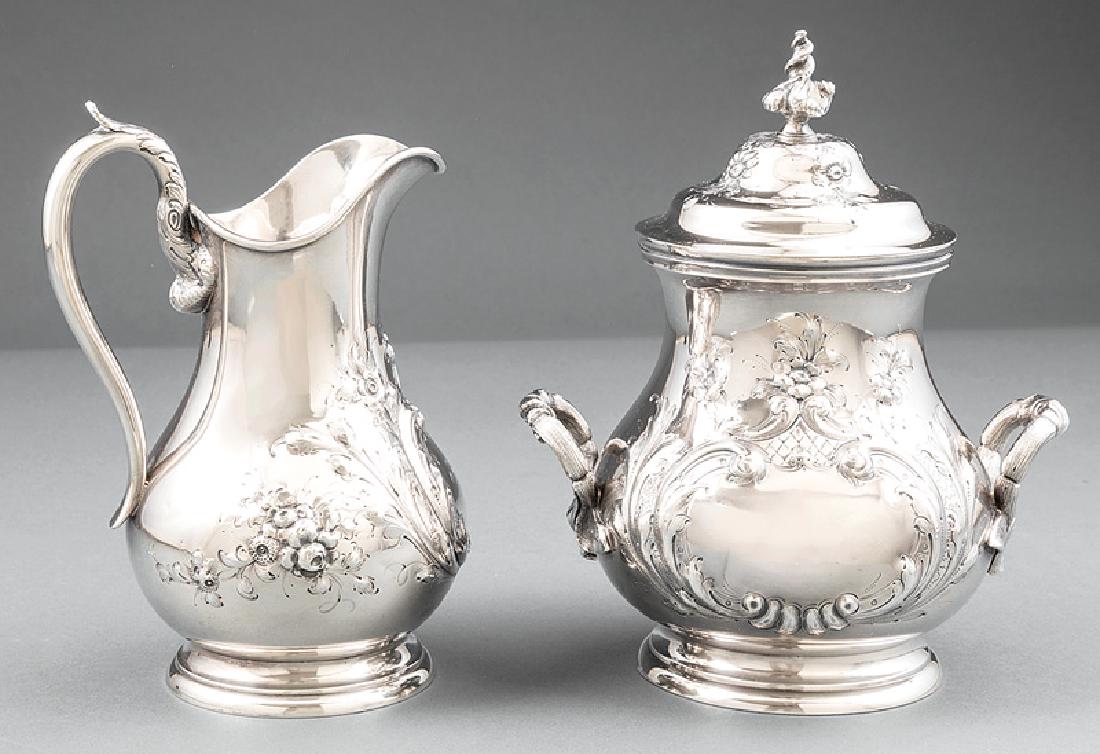 N. Harding & Co. Coin Silver Sugar and Creamer: Boston Coin Silver Repousse Sugar and Creamer, N. Harding & Co., act. 1851-1862, pyriform bodies with floral and scroll decoration and foliate handles, cartouches with 1860 presentation, sugar h. 8 in