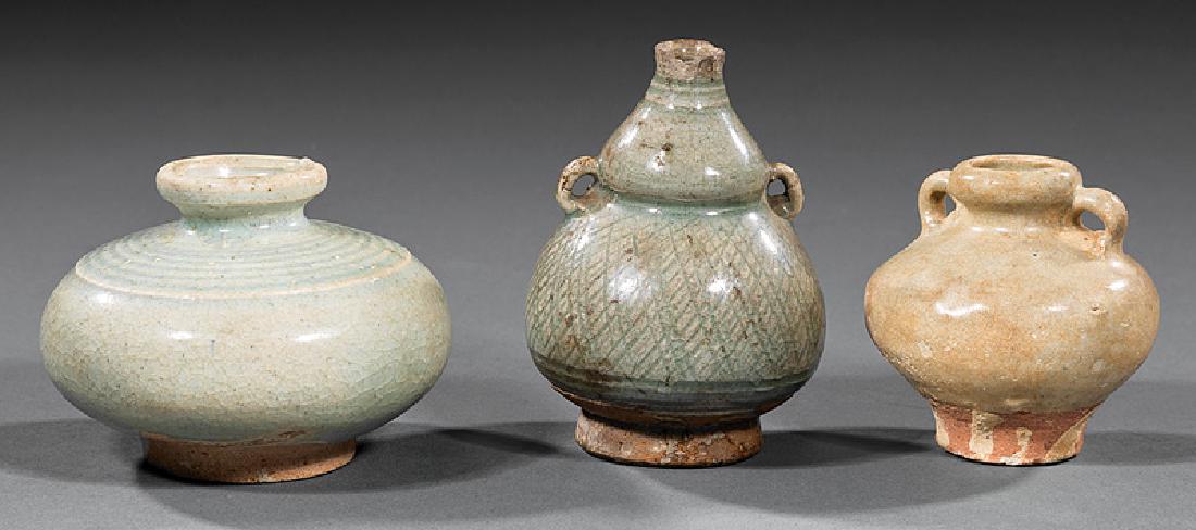 Three Chinese Celadon and Qingbai Pottery Vessels: Three Chinese Celadon and Qingbai Pottery Vessels, Ming Dynasty (1368-1644) and earlier, incl. globular jar, h. 2 1/2 in.; double gourd vase, h. 3 1/8 in.; and globular jar with handles, h. 2 1/2 in. 