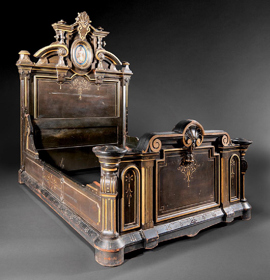 Carved, Gilt-Incised and Ebonized Bedstead: American Renaissance Carved, Gilt-Incised and Ebonized Bedstead, late 19th c., New York, headboard centering porcelain plaque, bracketed sides, shell carved foot board, shaped conforming rails, h. 87 