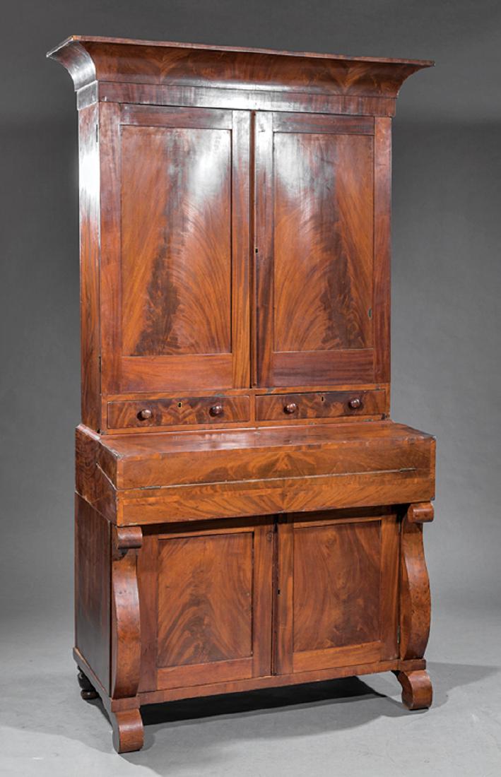 American Classical Carved Mahogany Secretary Desk: American Classical Carved Mahogany Secretary Desk, early 19th c., Baltimore, stenciled label "Bowers and Hume Cabinet Warehouse", cove molded cornice, paneled frieze doors enclosing shelves, two short