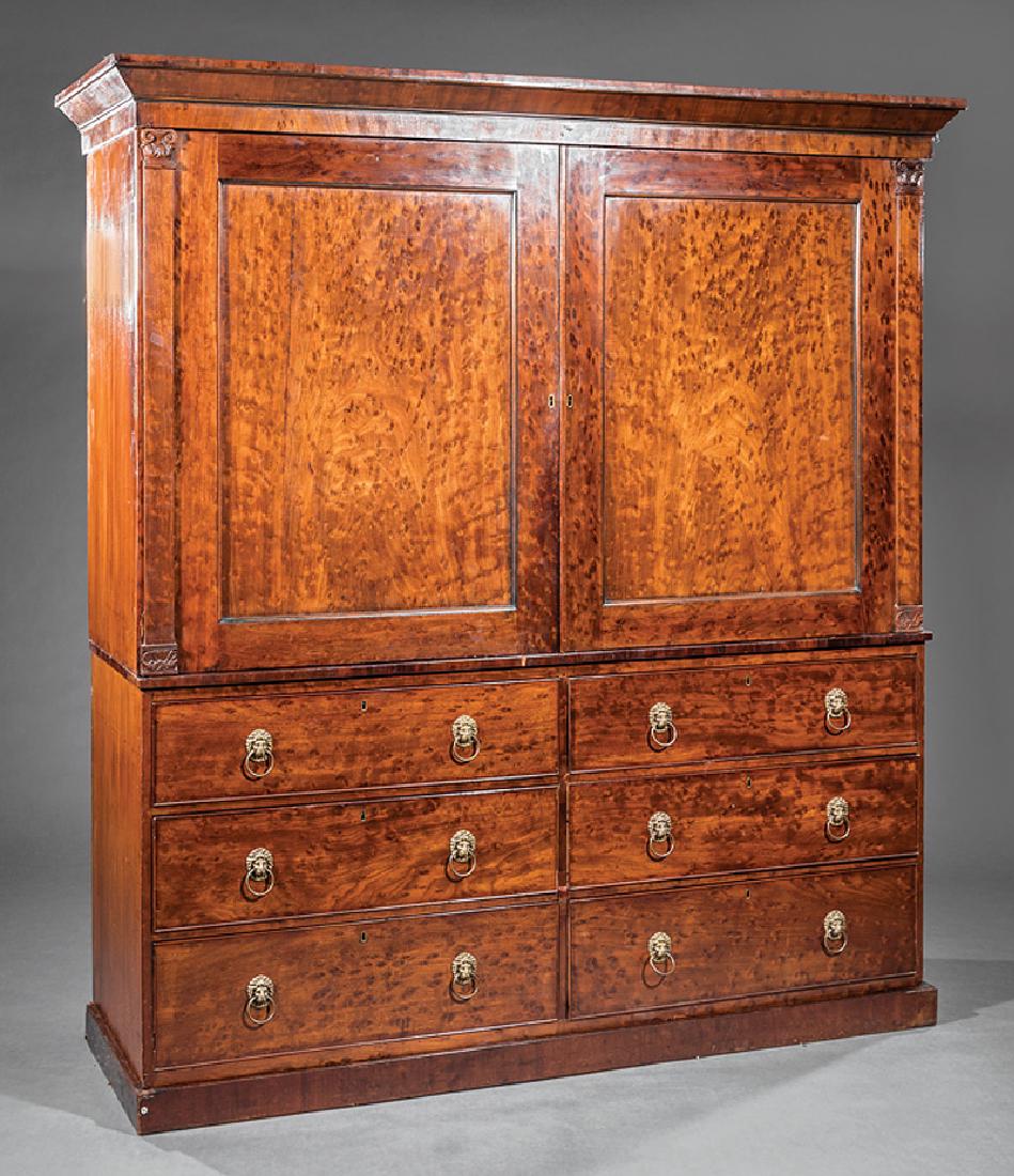 George IV Figured Mahogany Linen Press: George IV Figured Mahogany Linen Press, 19th c., molded cornice, upper case with doors flanked by columnar stiles, interior with linen shelves, lower case with six drawers, plinth base, h. 81 1/2 in.,
