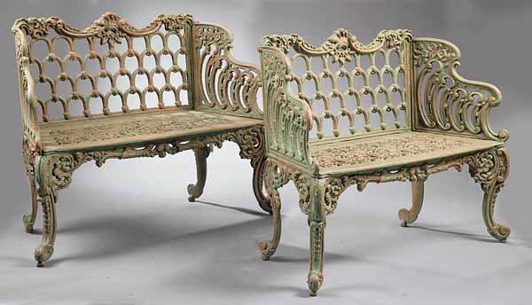 Pair Rococo Cast Iron Settees, Hinderers, New Orl: A Pair of American Rococo Cast Iron Settees , c. 1886-1920, New Orleans, marked "Hinderers Iron Works, NO, LA", with scalloped backs and arms and repeating pattern of interlocking arches with bud term