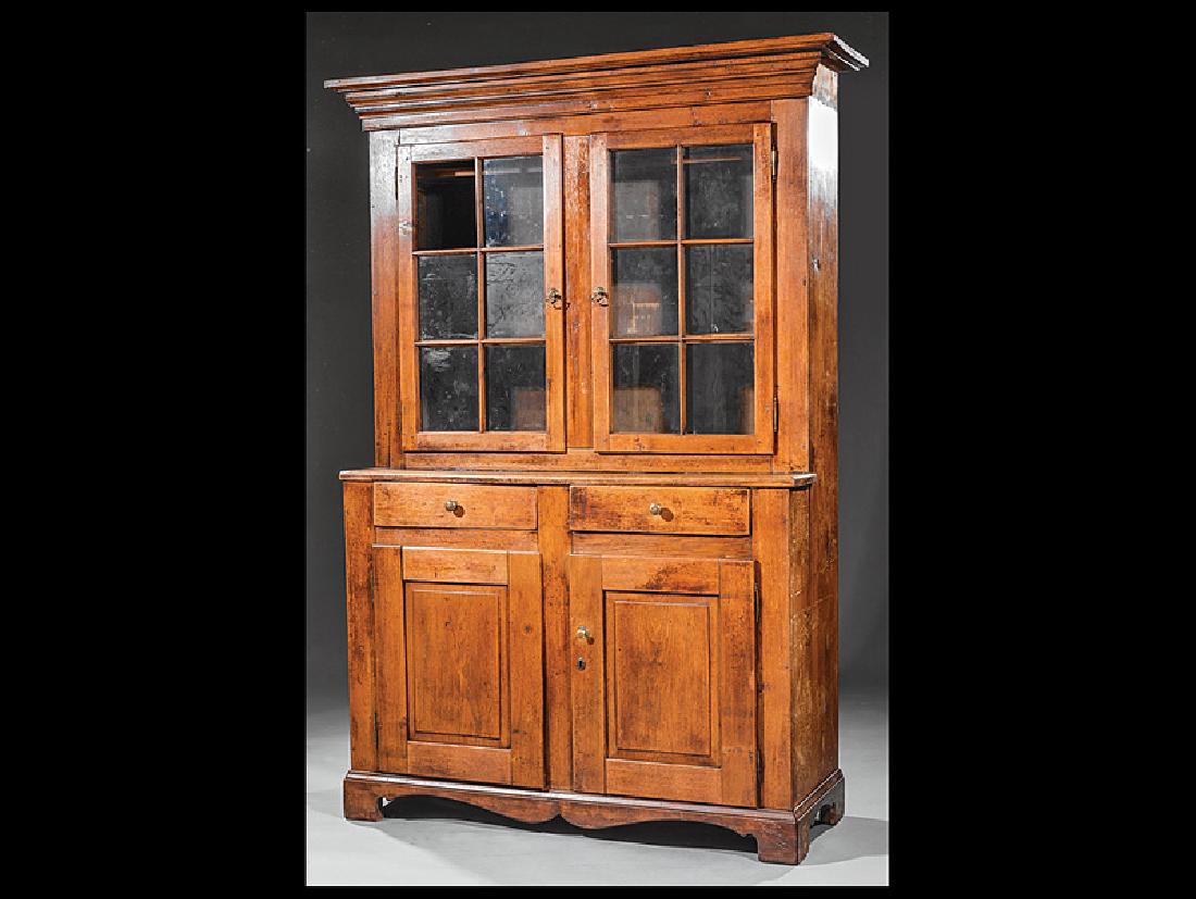 American Southern Carved Walnut Cupboard: American Southern Carved Walnut Cupboard, 19th c., stepped cornice, glazed doors, shelf interior, two frieze drawers, two lower paneled doors, scalloped apron, bracket feet, h. 83 in., w. 58 in., d. 1