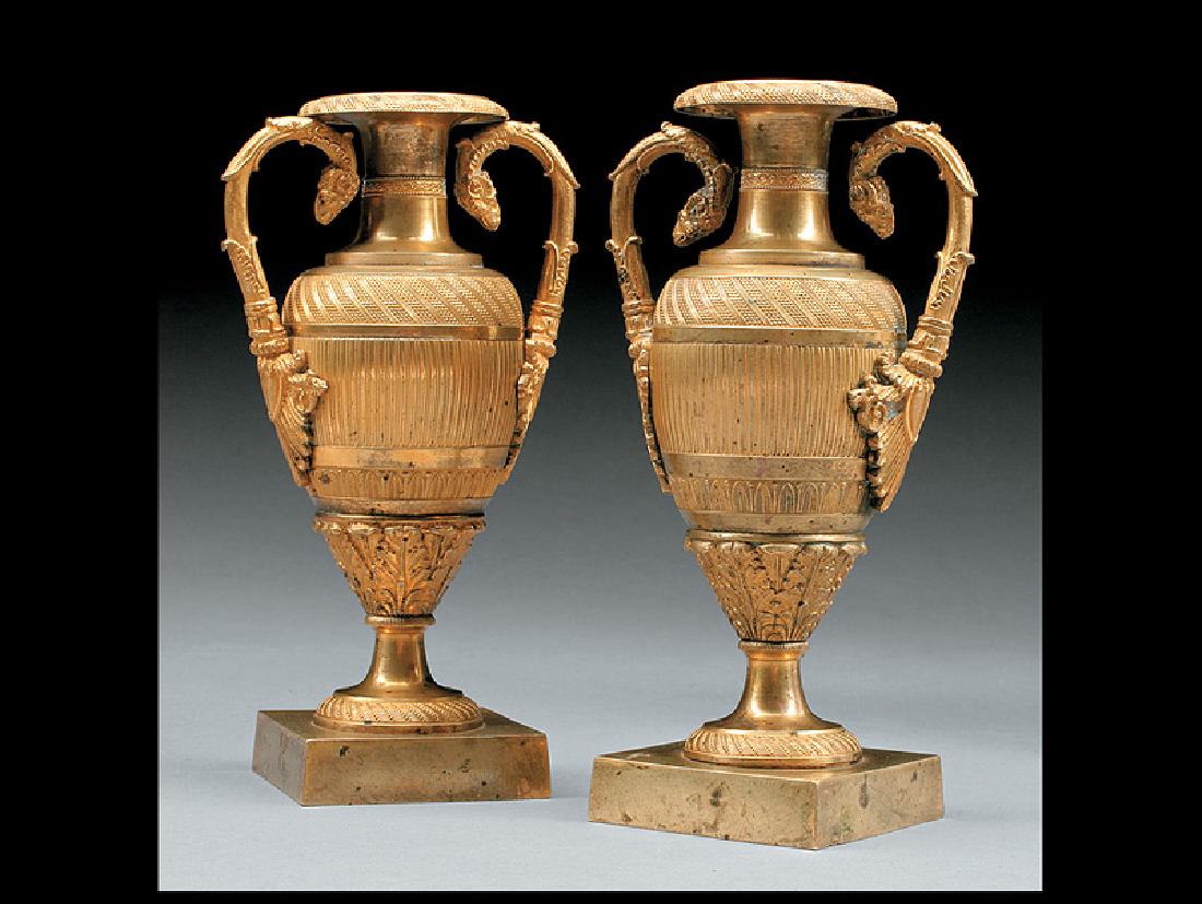 Pair of Charles X Gilt Bronze Amphora Vases: Pair of Charles X Gilt Bronze Amphora Vases, c. 1825, handles with ram's head terminals, bodies with ribbed and foliate bands, h. 8 1/2 in., w. 4 1/2 in., d. 3 in