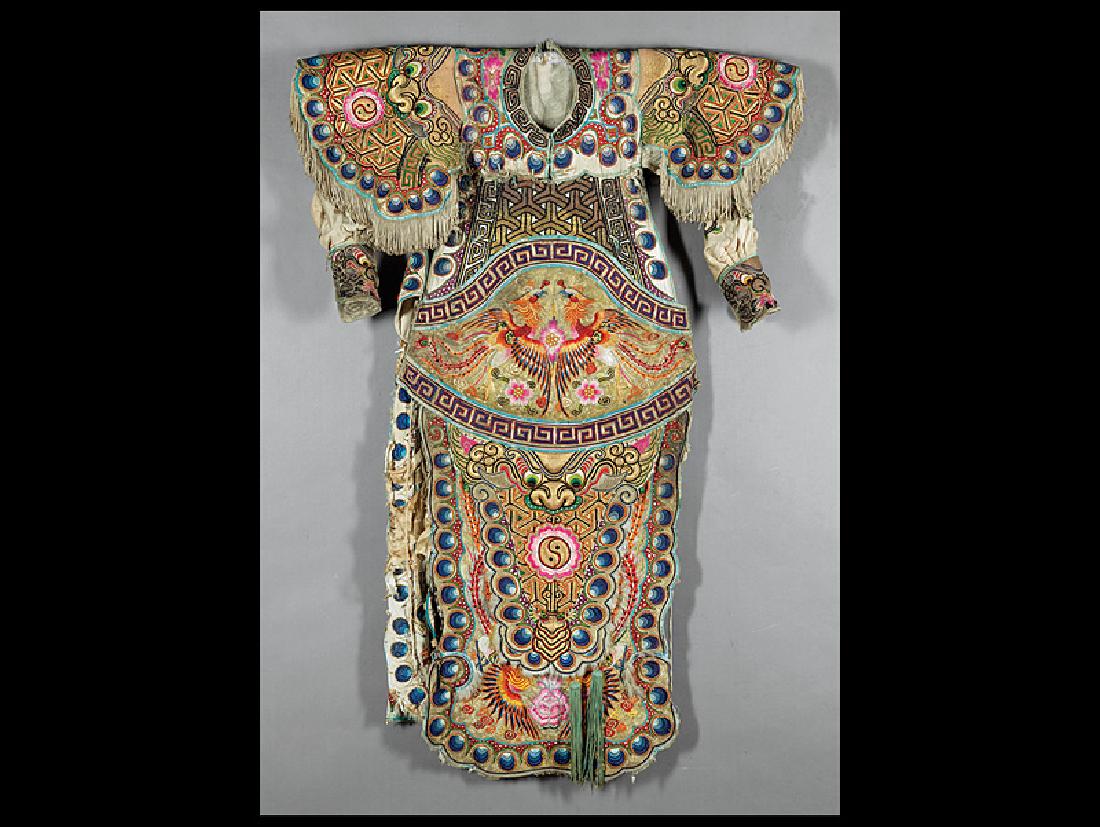 Chinese Embroidered White Silk Opera Robe: Chinese Embroidered White Silk Opera Robe, late Qing Dynasty (1644-1911), worked in satin stitch and couched metallic threads with peacock and dragon designs, padded and feather highlights, h. 53 in.,