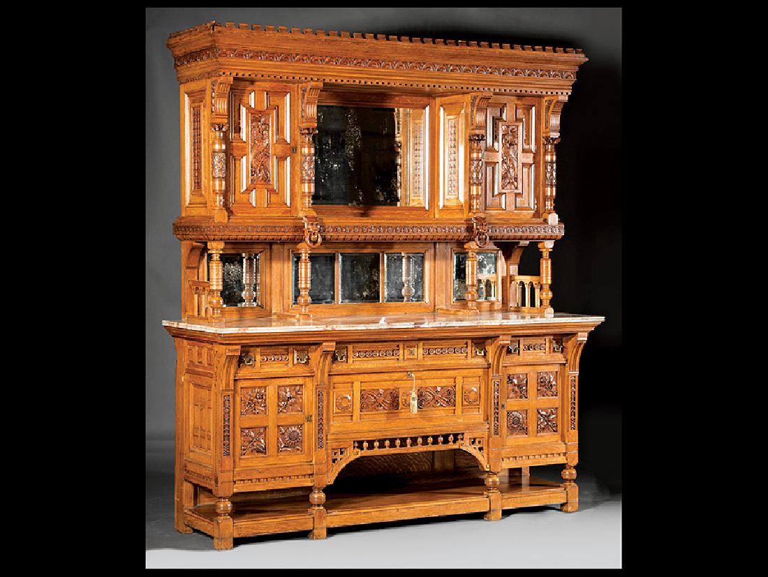 Carved Oak Breakfront attr. Herter Brothers: American Aesthetic Carved Oak Breakfront, late 19th c., attr. to Herter Brothers, New York, flared cornice surmounted by a dentil-molded border, carved frieze, upper inset beveled mirror panel flanked
