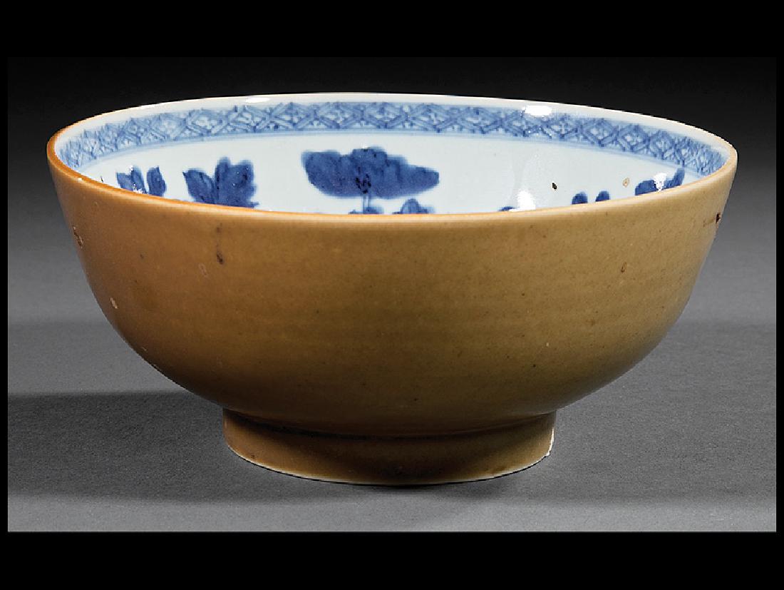Two Chinese Export Batavia Ware Bowls: Two Chinese Export Batavia Ware Bowls, Qing Dynasty (1644-1911), larger with blue and white floral interior, h. 3 in., dia. 6 1/2 in; smaller with fish interior, h. 2 1/8 in., dia. 4 1/8 in. Provenanc
