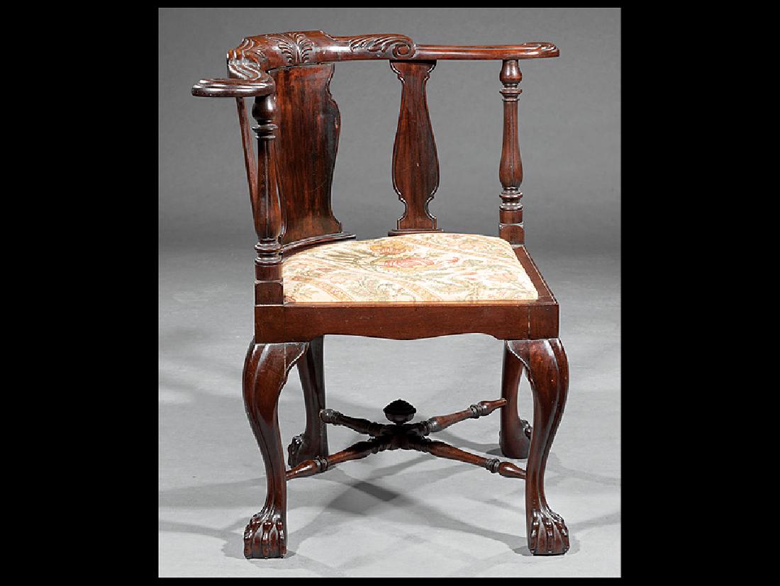George II-Style Carved Mahogany Corner Chair: George II-Style Carved Mahogany Corner Chair, 19th c., scrolled acanthus-carved crest rail, vasiform splats, cabriole legs, ball and claw feet, turned X stretcher, h. 30 3/4 in., w. 33 in., d. 22 in