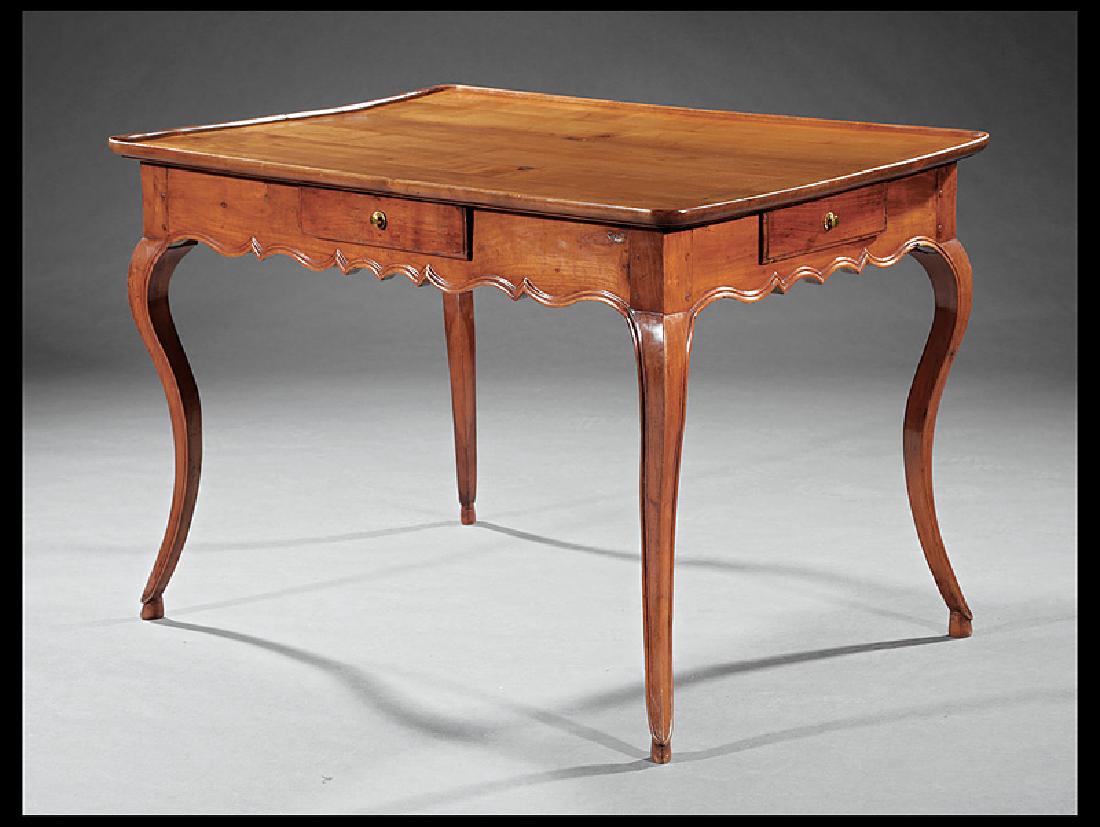 French Provincial Carved Fruitwood Tea Table: French Provincial Carved Fruitwood Tea Table, tray top, shaped frieze with four drawers, molded cabriole legs, h. 28 1/2 in., w. 41 1/2 in., d. 28 1/2 in