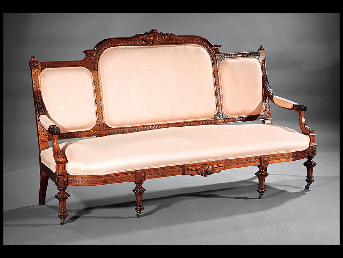 American Renaissance Carved Walnut Settee: American Renaissance Carved Walnut Settee, c. 1870, triple back, guilloche molding, shaped seat rail, fluted legs, toupie feet, casters, h. 45 in., w. 45 in., d. 21 in