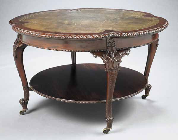Carved Mahogany and Tooled Leather Library Table: A George III-Style Finely Carved Mahogany and Tooled Leather Library Table , late 19th c., in the Rococo style of Thomas Chippendale , height 30 in., width 51 in * NO RETURNS ARE ACCEPTED ON THE BASIS