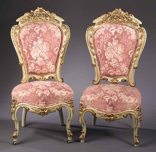 A Pair of American Carved Rosewood Cha: A Pair of American Carved Rosewood Chaises , c. 1855, New York, in the manner of J.& J.W. Meeks, the floral cartouche above a padded back and seat, raised on cabriole legs, now in painted surface, hei